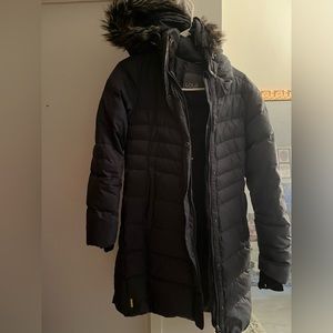 Long, Knee length Warm Puffer Coat in size Medium with faux fur trim hood. Grey